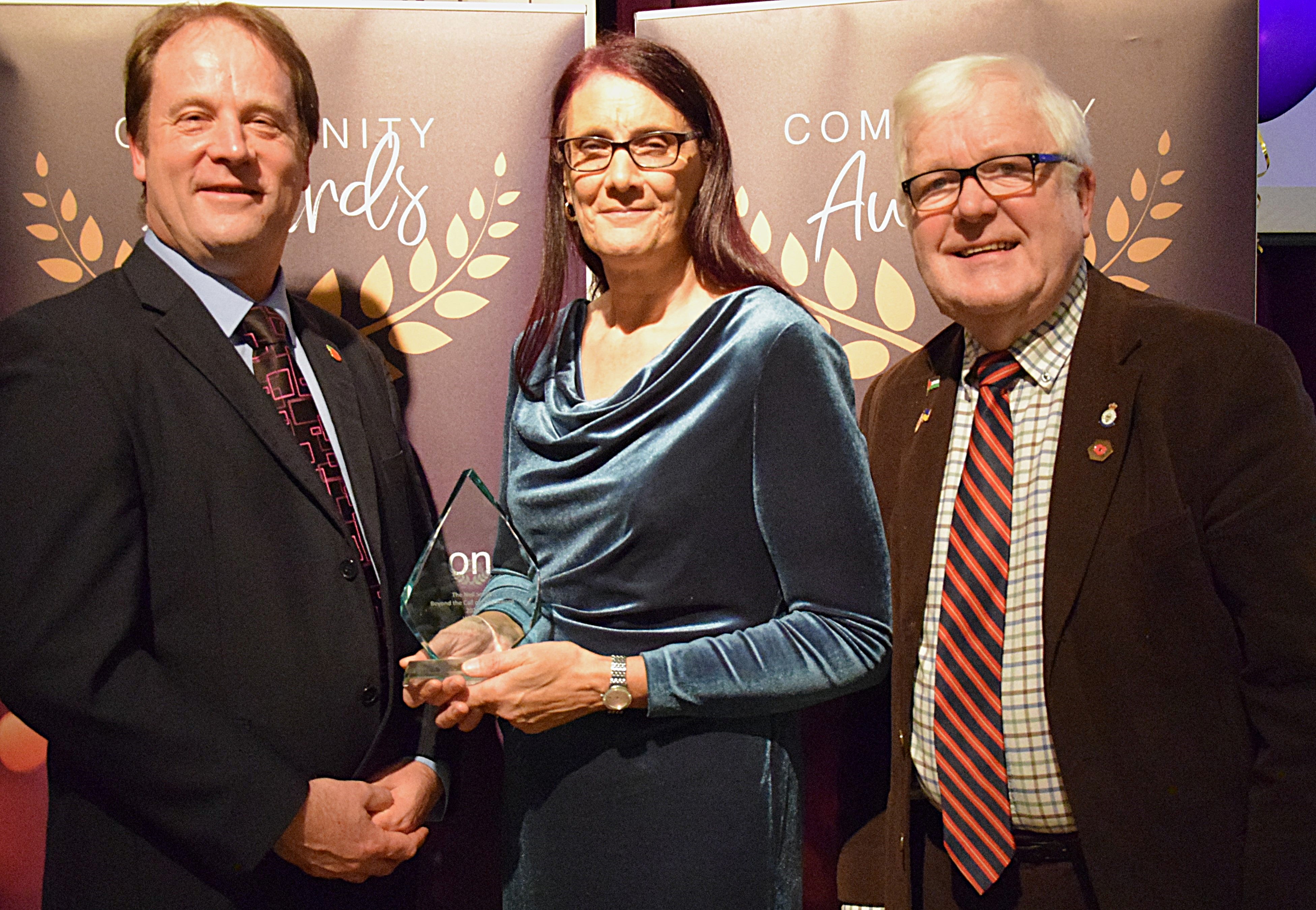 Cll Ashley Baxter and Cllr Phil Dilks with Fiona Pery, winner of the Neil Smith Beyond the Call of Duty Award