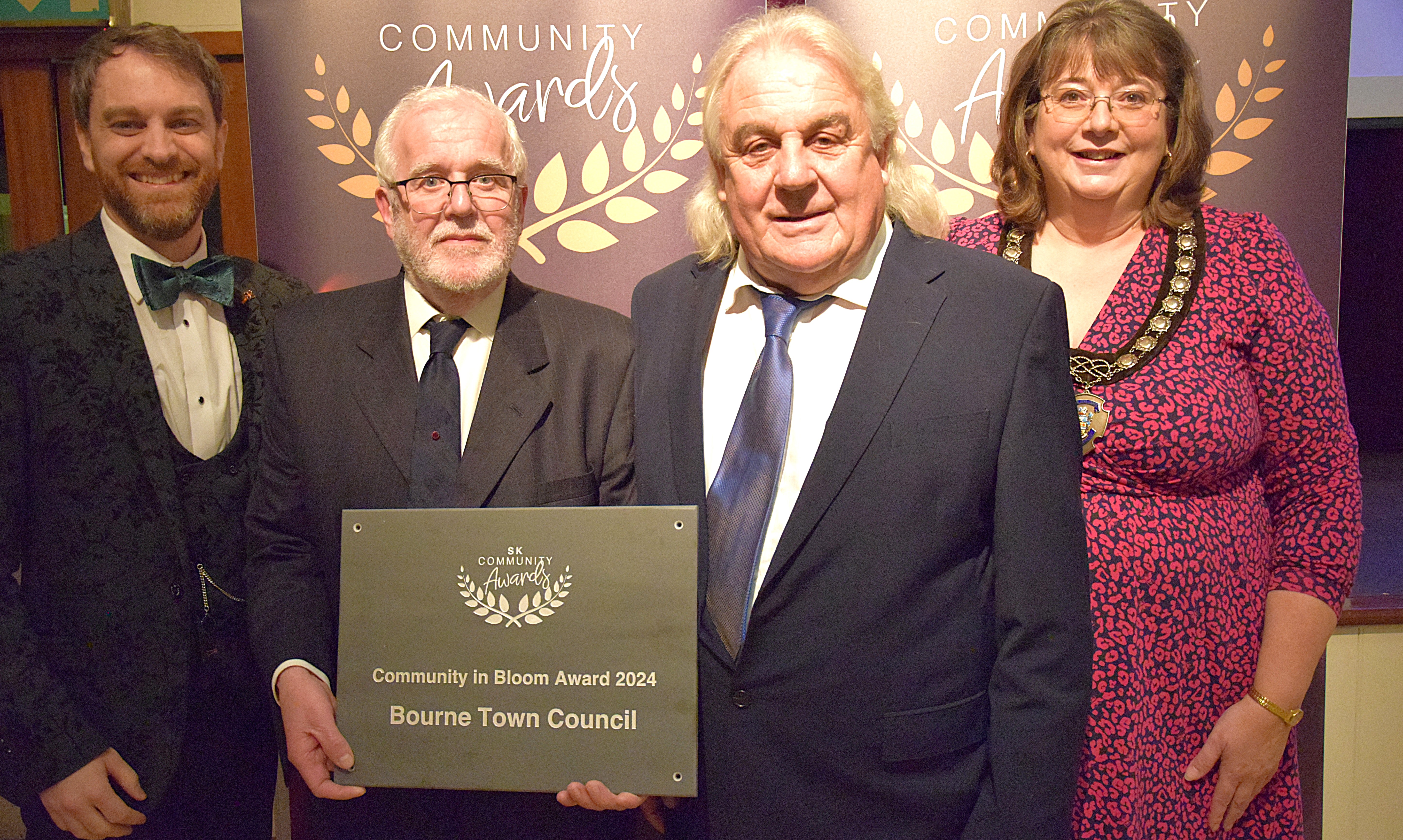 Cllrs Rhys Baker and Helen Crawford with Phil Whyles (left) and Bill Pauley who collected the Community in Bloom Award on behalf of Bourne Town Council