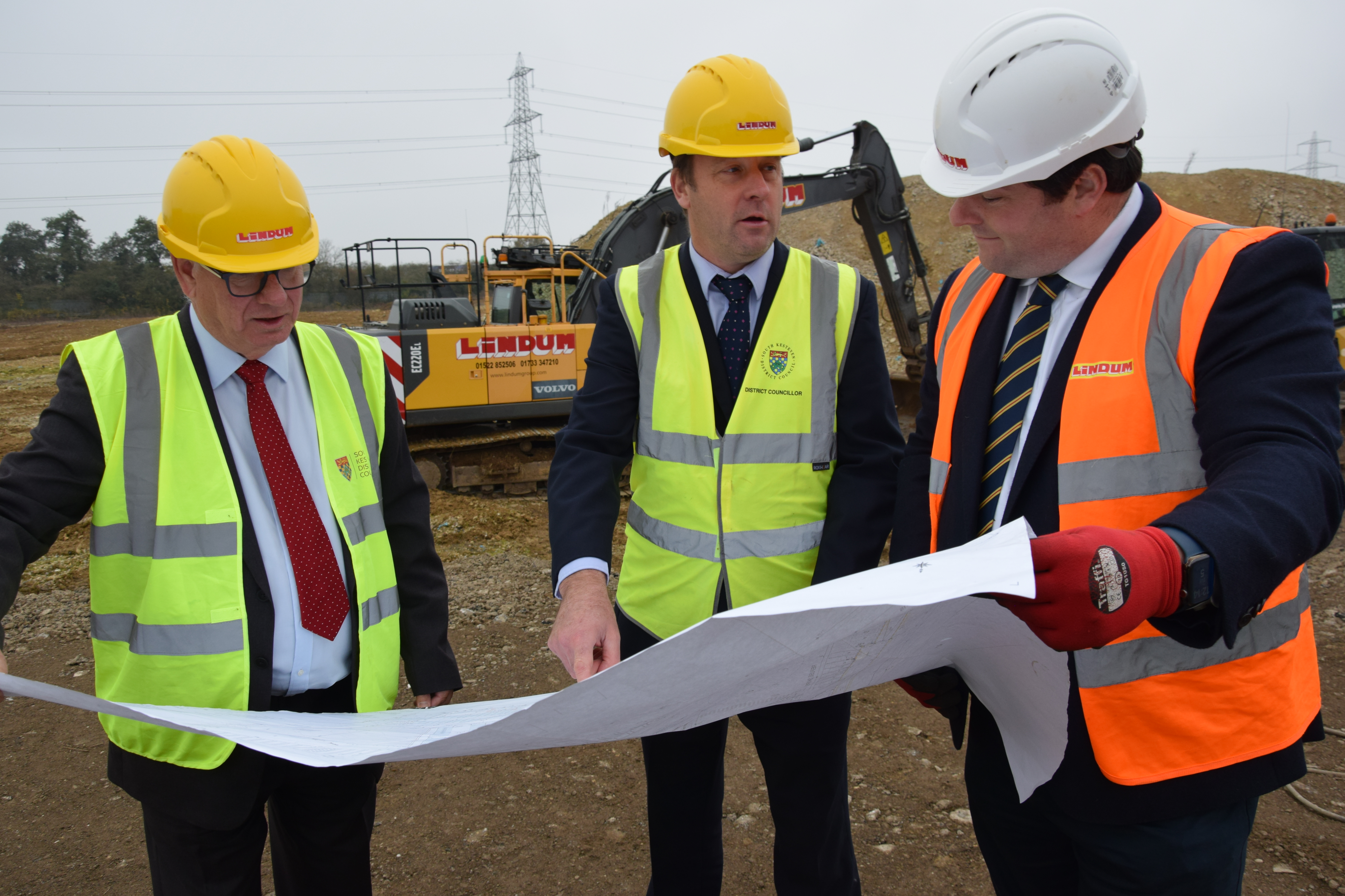 Pictured with plans for the depot site are, left to right, SKDC Cabinet Member for Property  and Public Engagement Cllr Richard Cleaver, Leader of the council Cllr Ashley Baxter and Lindum Group Co-chairman Edward Chambers.