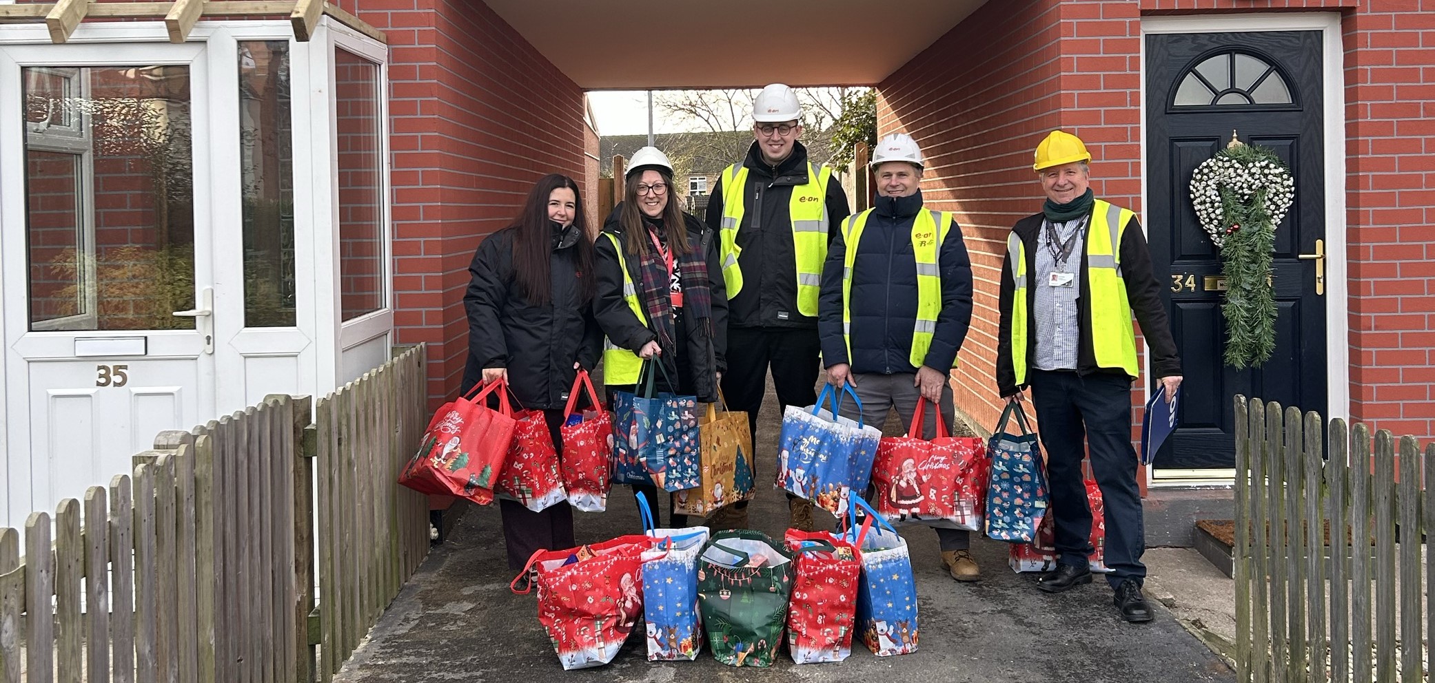 EON & SKDC Hamper Presentation Team at Turnor Crescent