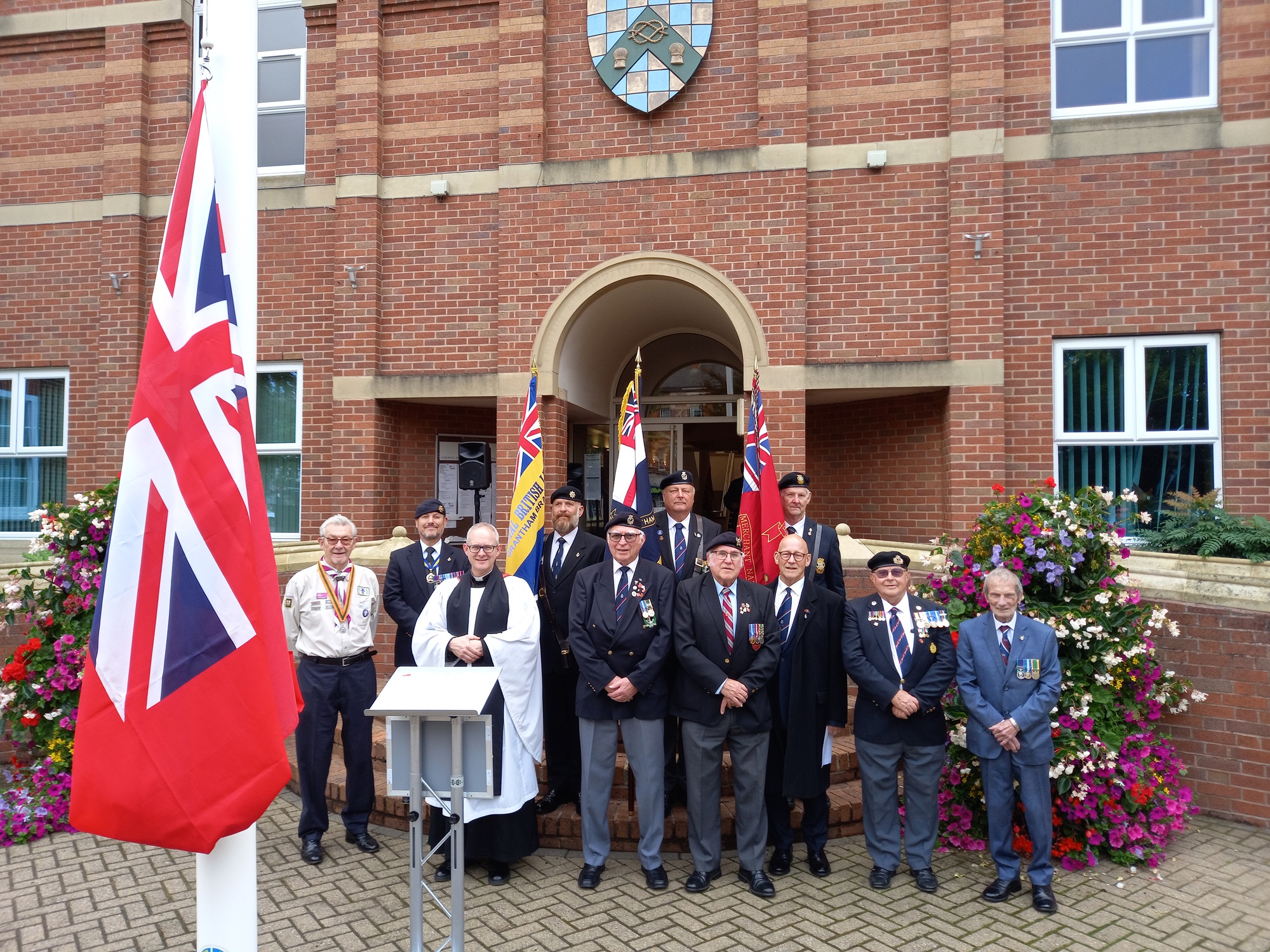 Guests for the Merchant Navy Day flag raising at St Peter's Hill