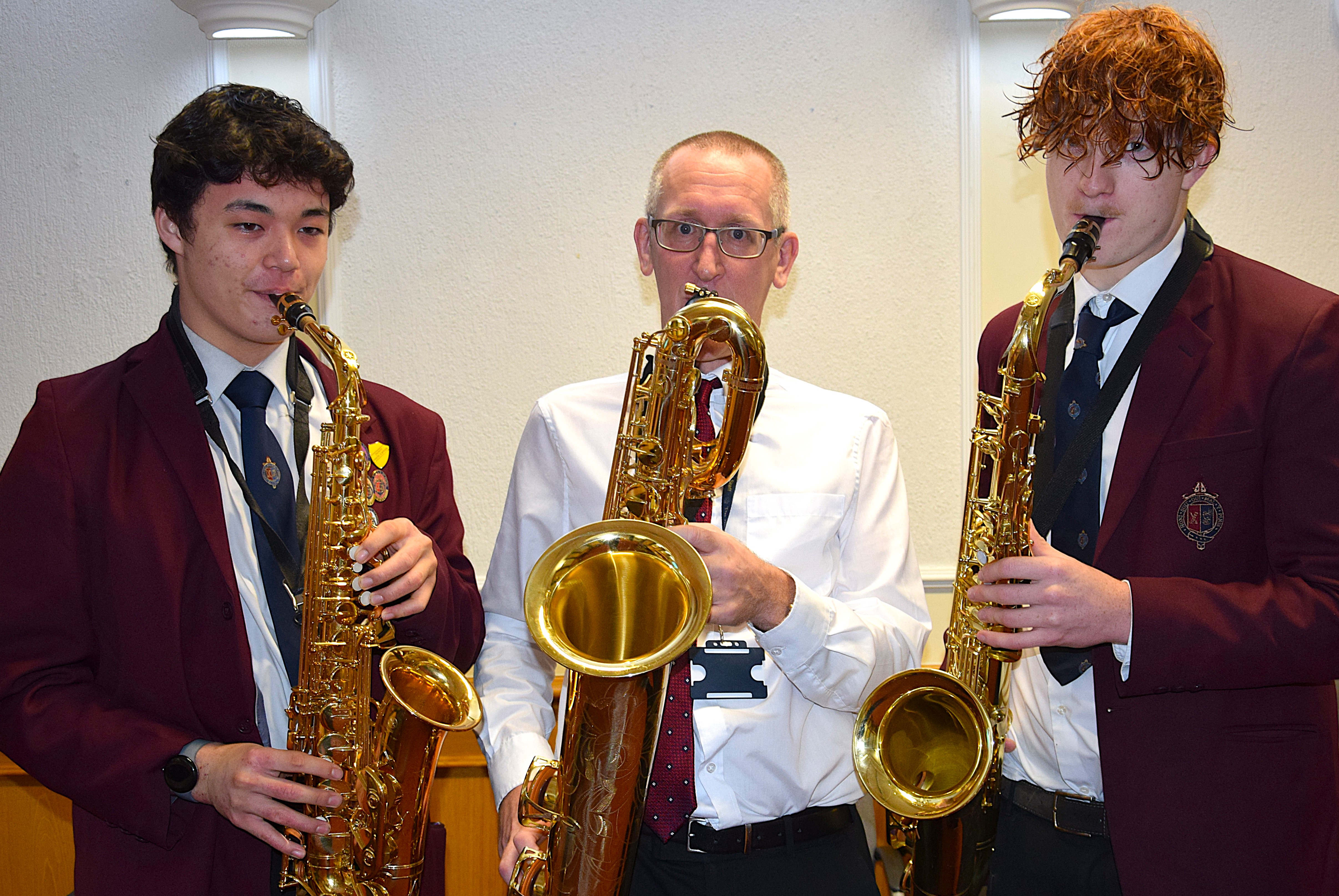 King's School - Sixth formers Thomas Li (left) and Gabriel Bateson with Director of Music Matt Lind.